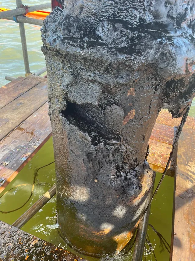 A corroded well conductor before its Belzona composite repair, a real SUAC job