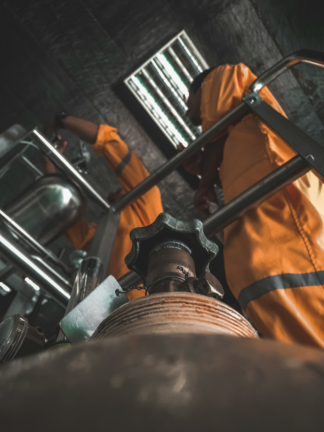 Crew servicing a large valve